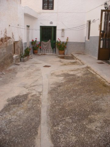 Village property in Freila, Granada with charming white walls and a cozy entrance. Perfect for those.