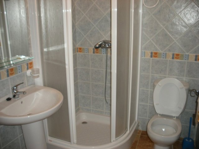 Modern bathroom with shower enclosure and toilet in Castillejar, Granada.