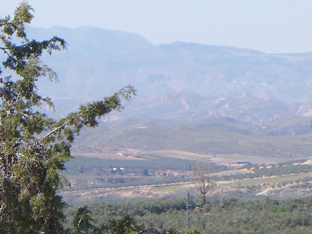 Cave house located in Cuevas del Campo, Granada, surrounded by scenic mountains and rural landscape.