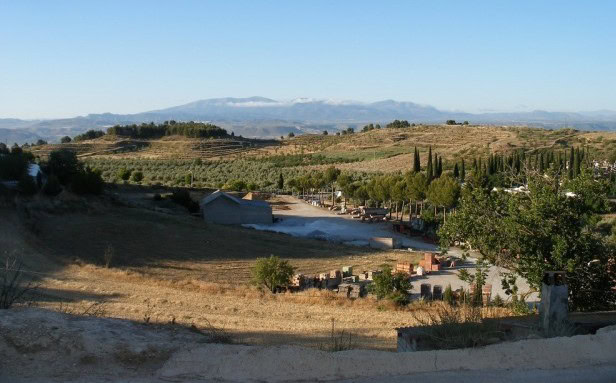 Cave house located in Cuevas del Campo, Granada, surrounded by scenic countryside and mountains.