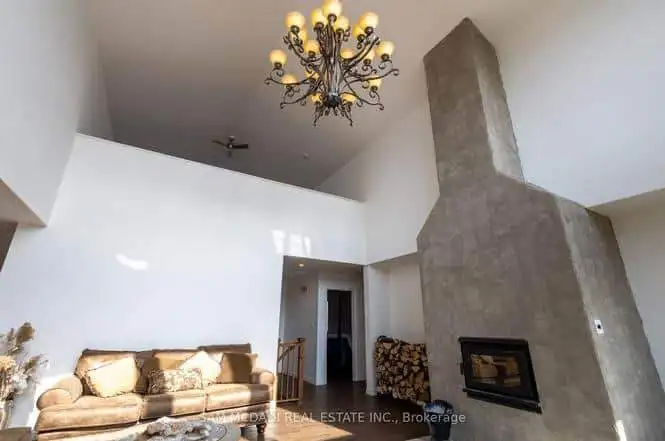 Elegant 3-bedroom estate for sale in Belmont, Ontario, featuring a spacious living area with a conte.