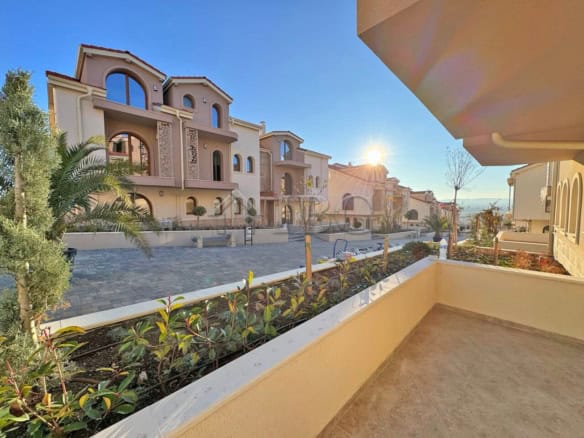 Bright balcony view of residential complex in Kosharitsa, Bulgaria.