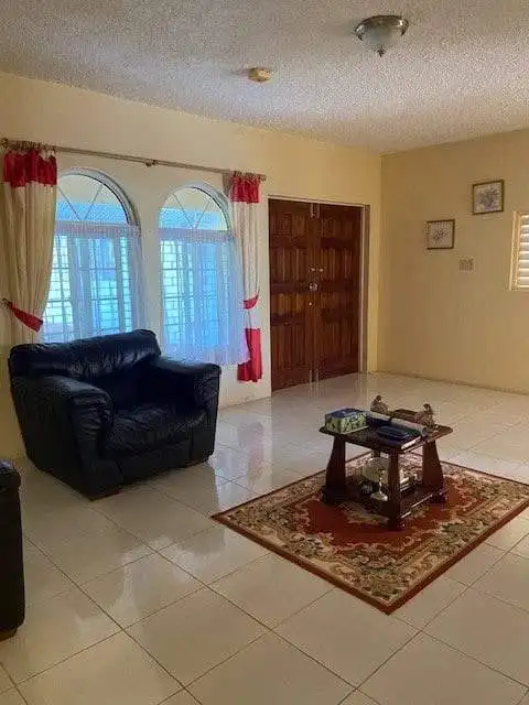 Spacious living room in a 8-bedroom estate for sale in Portland, Port Antonio, Jamaica. Modern inter.