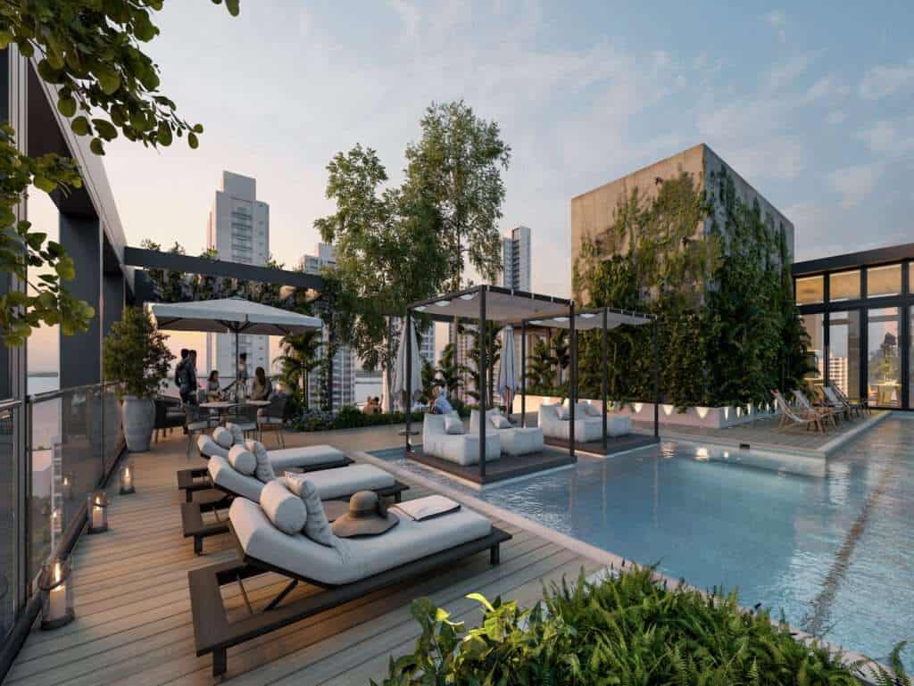 Panama City rooftop pool with sunbeds, shaded cabanas, and city skyline views. Perfect for relaxatio.