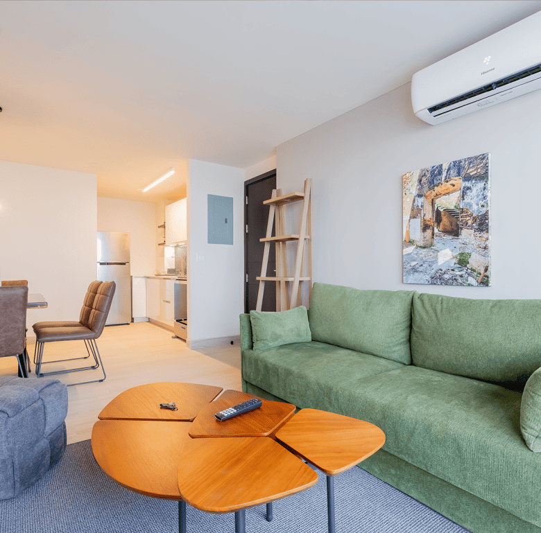 Modern living room in Panama City apartment with stylish decor and comfortable furniture.