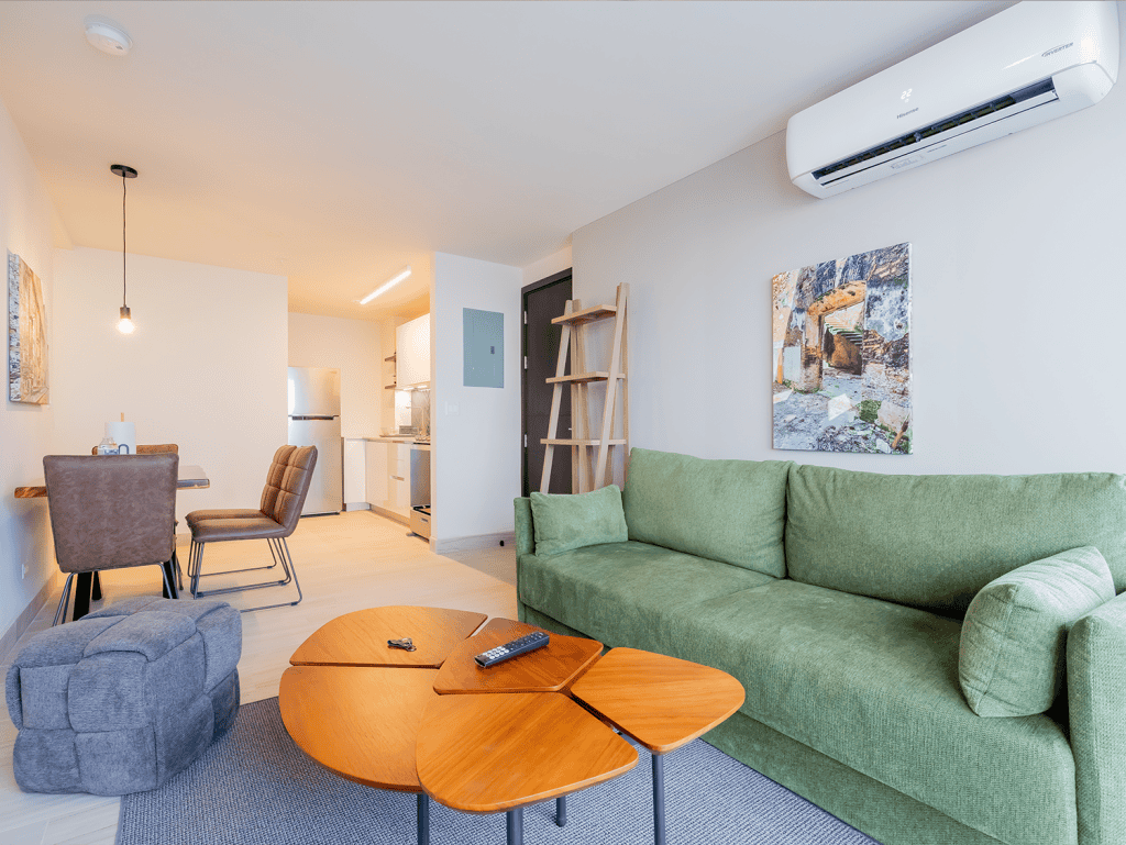 Modern living room in Panama City apartment with stylish decor and comfortable furniture.