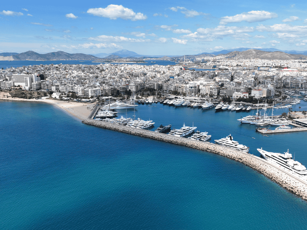 Aerial view of Skyway in Athens, Greece, showcasing the marina and city skyline.
