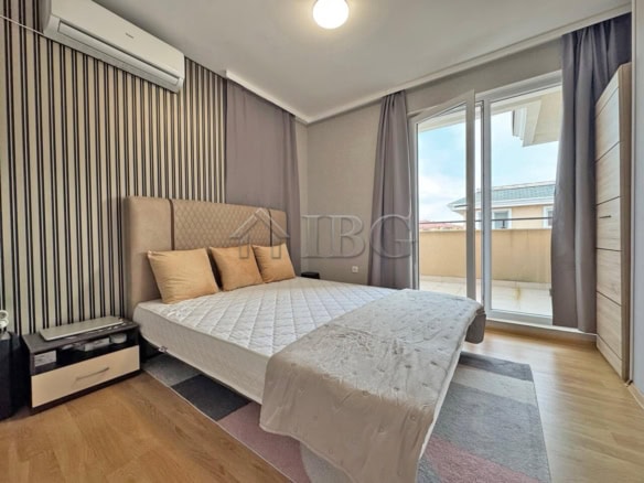 Bright bedroom with balcony view at Messembria Resort, Sunny Beach.