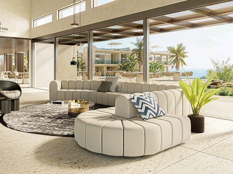 Spacious contemporary living room with large windows overlooking the ocean and tropical palm trees i.