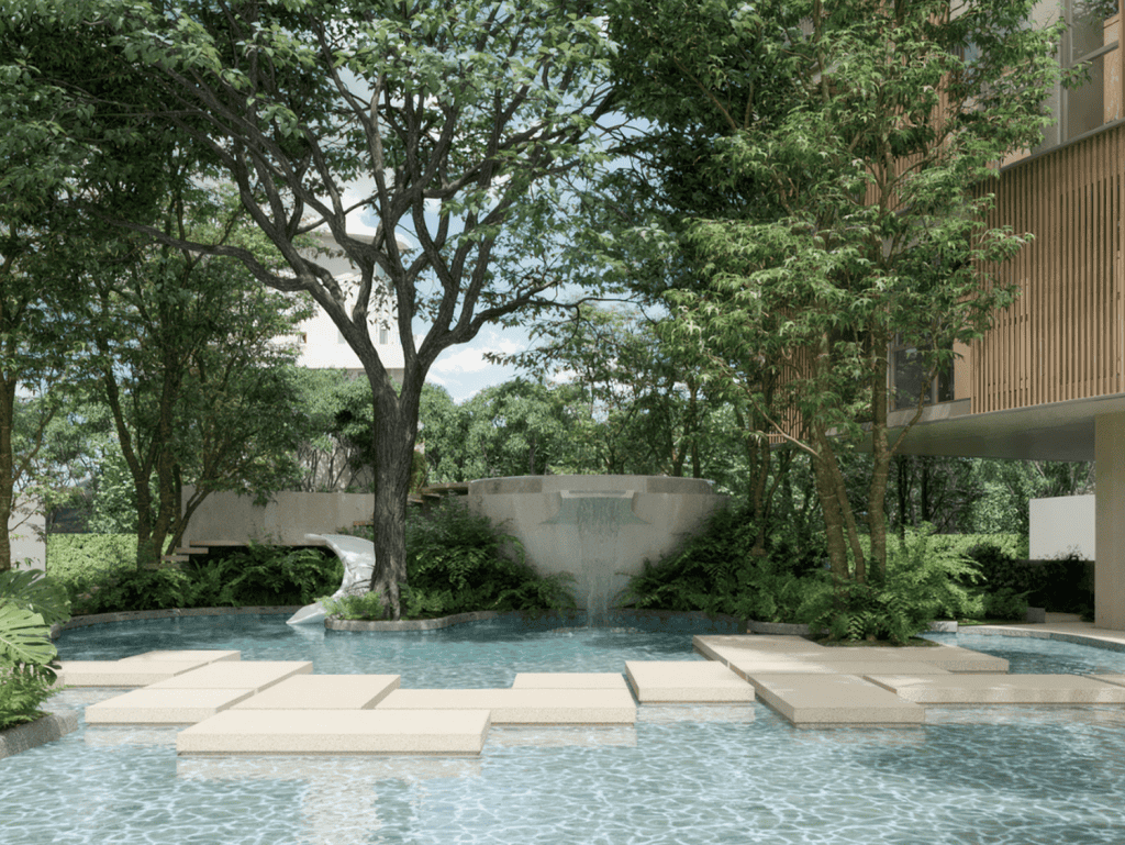 Luxury Phuket pool with water fountain and lush greenery, perfect for relaxation.