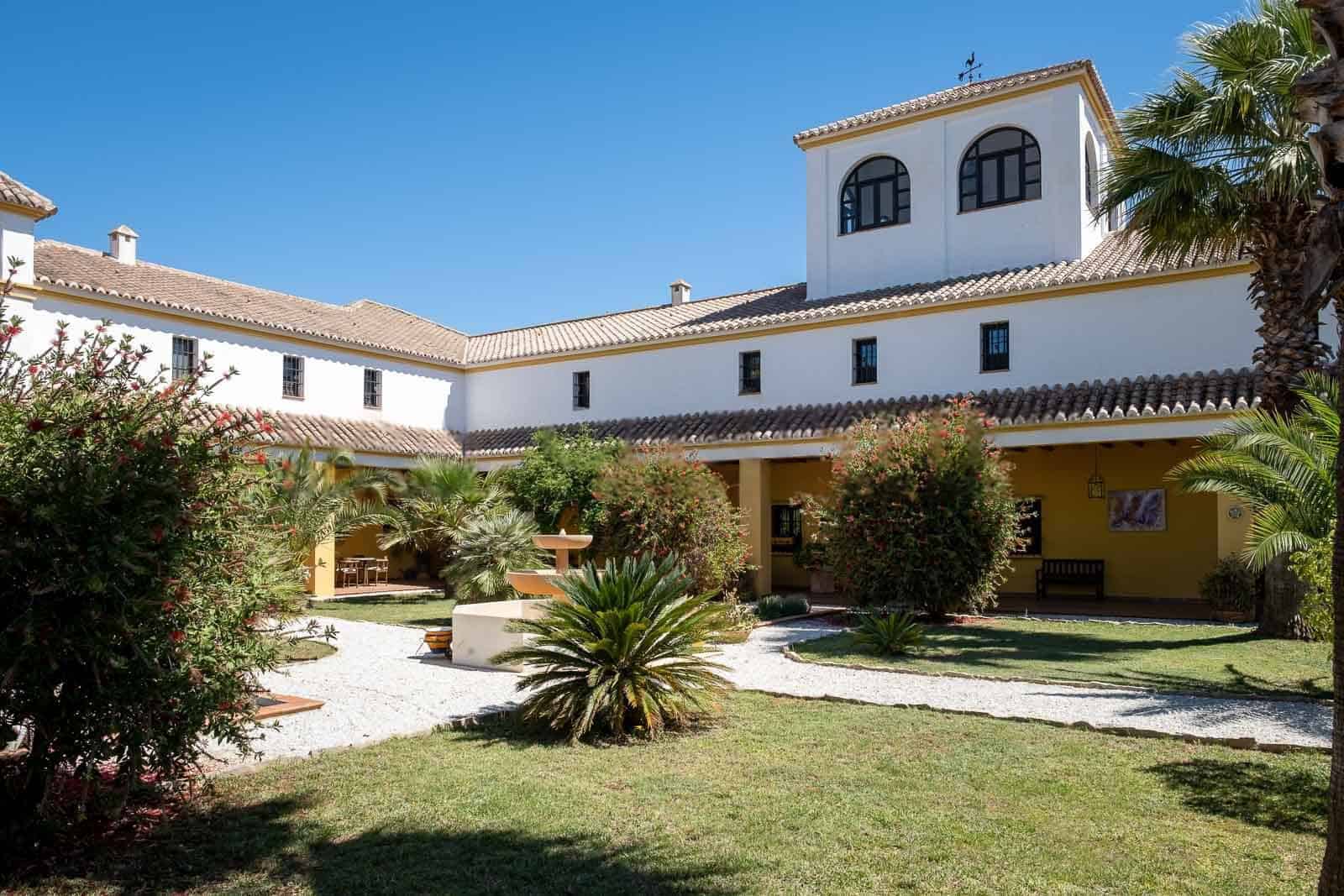 Elegant Spanish villa featuring lush gardens and a private pool. Perfect for luxurious living and in.