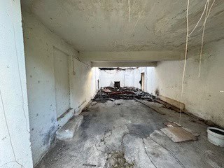 Interior view of a renovation project in Fortlands, Saint Kitts, showing unfinished concrete walls a.