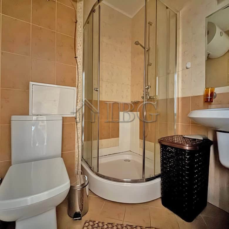 Cozy bathroom in a furnished one-bedroom apartment at Royal Sun, Sunny Beach, featuring a shower, to.