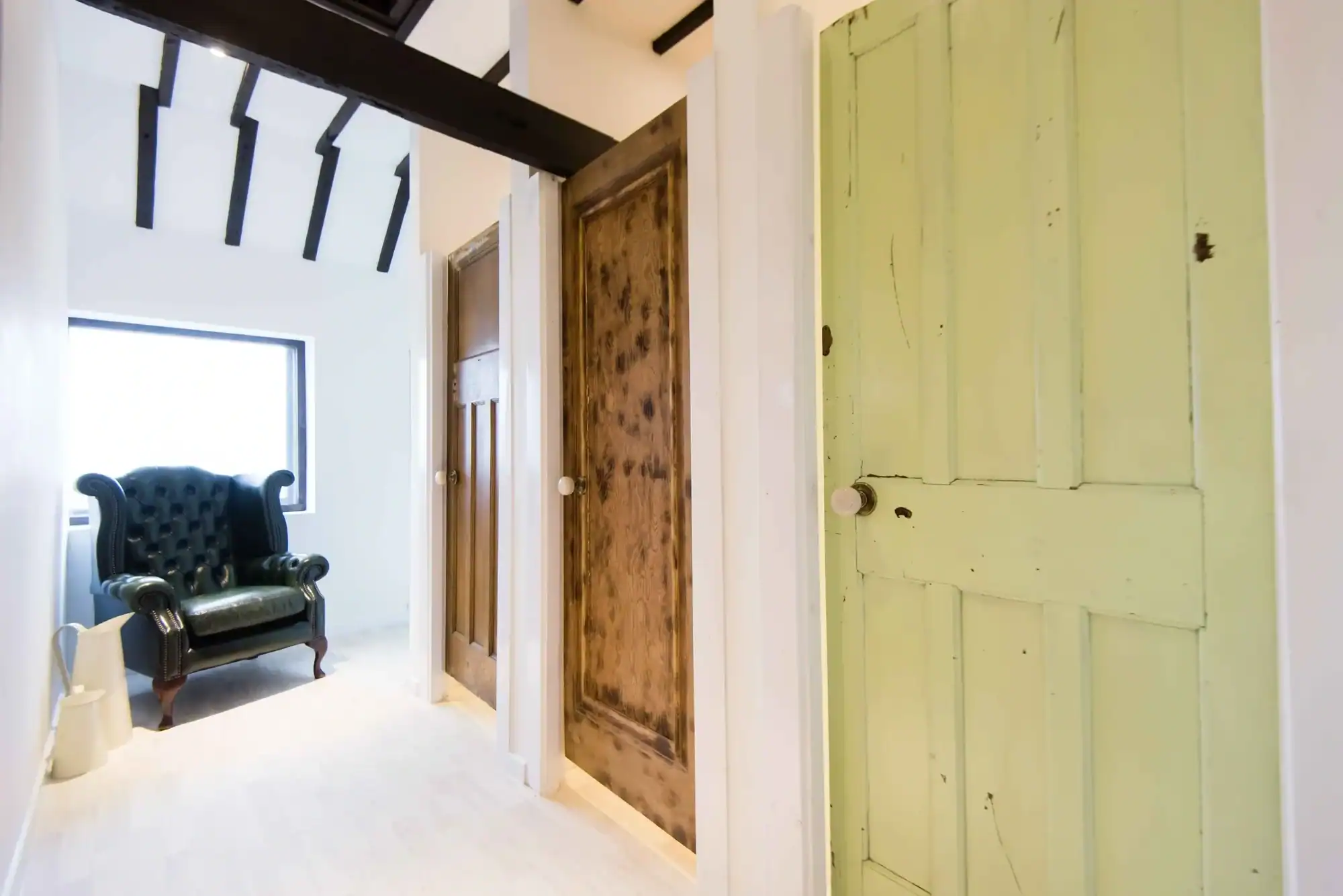 Cozy Interior with Vintage Doors Interior view featuring vintage wooden doors and a cozy sitting area.