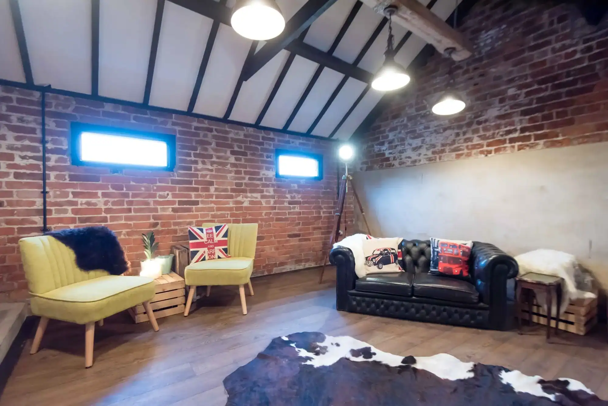 Modern loft living room with brick walls and stylish furniture. Stylish loft living room with brick walls, cozy seating, and modern decor.