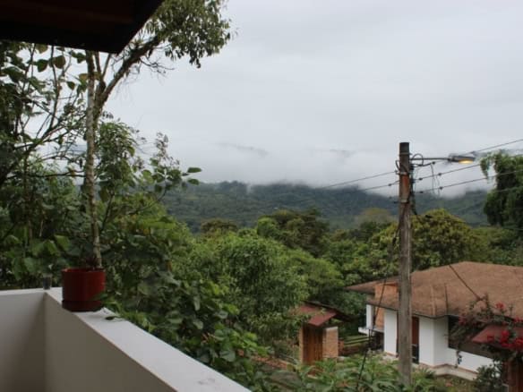 House with mountain view and greenery in Ecuador.