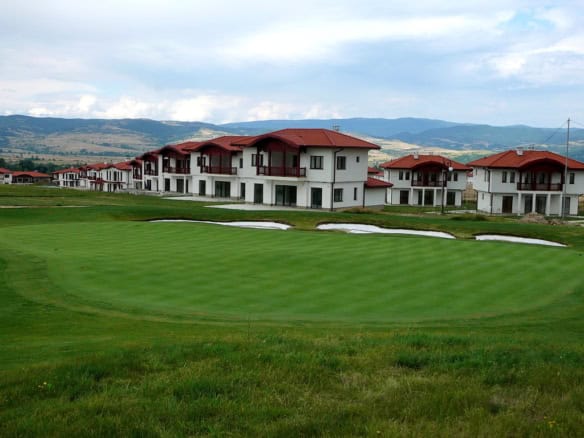 Golf course land for sale in Bulgaria with scenic mountain views.