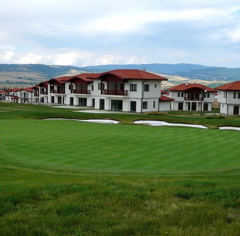 Golf course land for sale in Bulgaria with scenic mountain views.