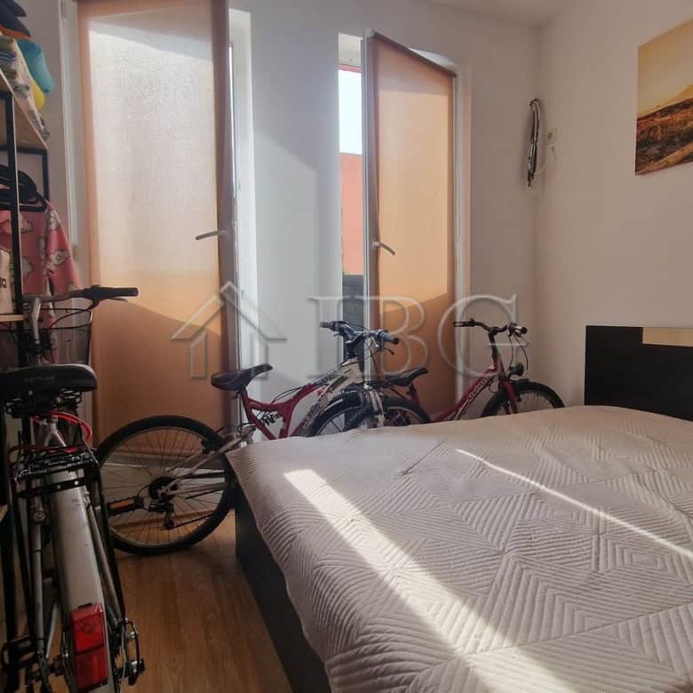 Interior view of a 1-bedroom apartment with pool view in Sunny Beach area.