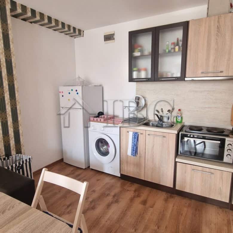 Interior of a 1-bedroom apartment with kitchen and pool view in Sunny Beach area.