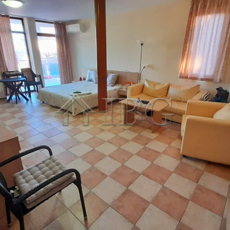 Bright studio apartment with balcony in Kaya, Sunny Beach, offering comfortable living space.