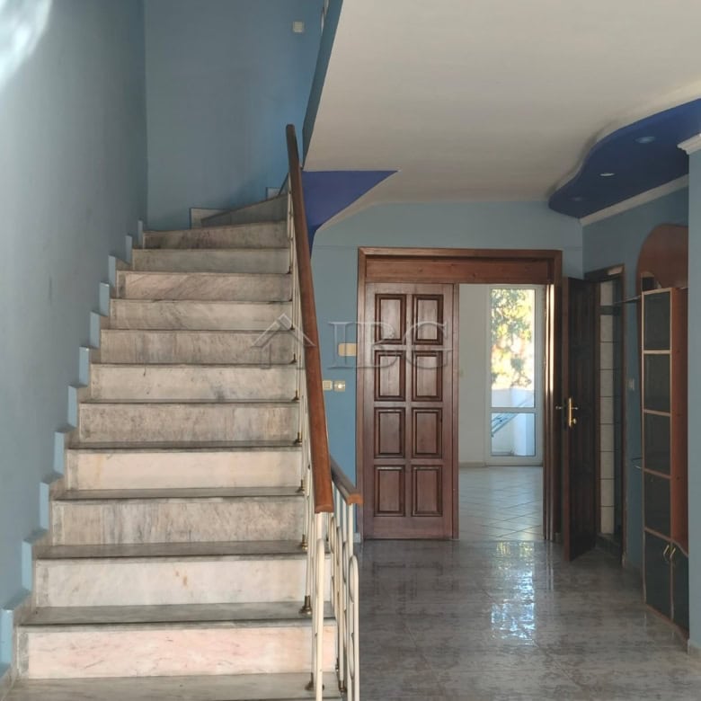Bright interior of a maisonette with panoramic sea views in Sveti Vlas. Features a staircase, wooden.