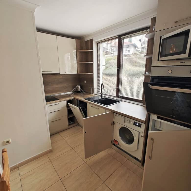 Bright studio apartment with separate kitchen and balcony, perfect for seaside living.