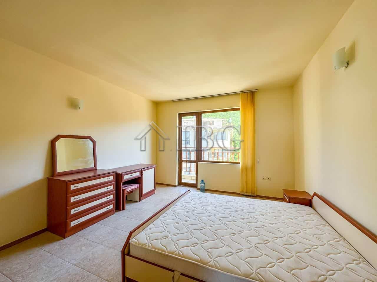 Sea view bedroom in Sveti Vlas 1-bedroom apartment with balcony and natural light.