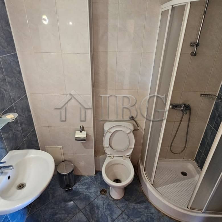 Bathroom with shower, toilet, and sink at Tria Apartments, Sunny Beach.
