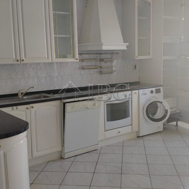 White kitchen with appliances and panoramic sea views in Sveti Vlas.