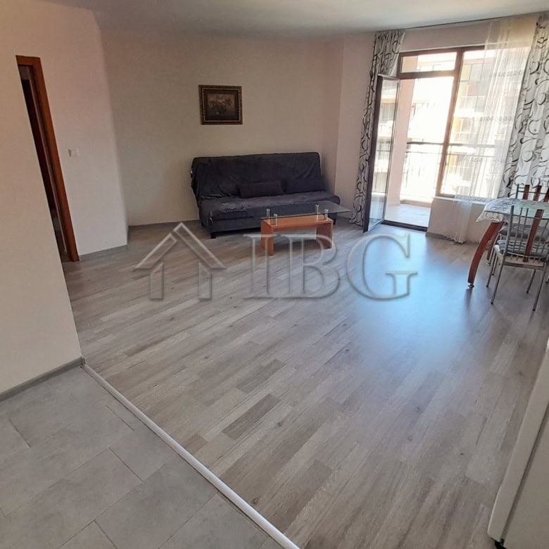 Bright living room with pool view in Sea Grace complex, Sunny Beach. Modern furnishings and spacious.