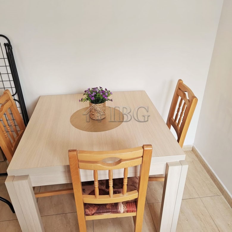 Compact studio with separate kitchen and balcony, perfect for seaside living.