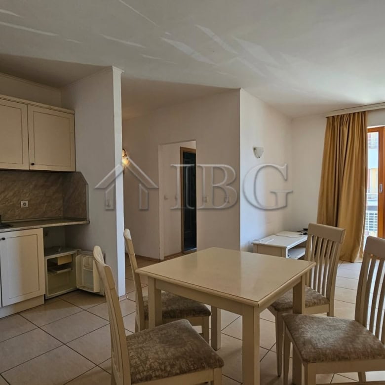 Bright living room with dining area and balcony in Tria Apartments, Sunny Beach.