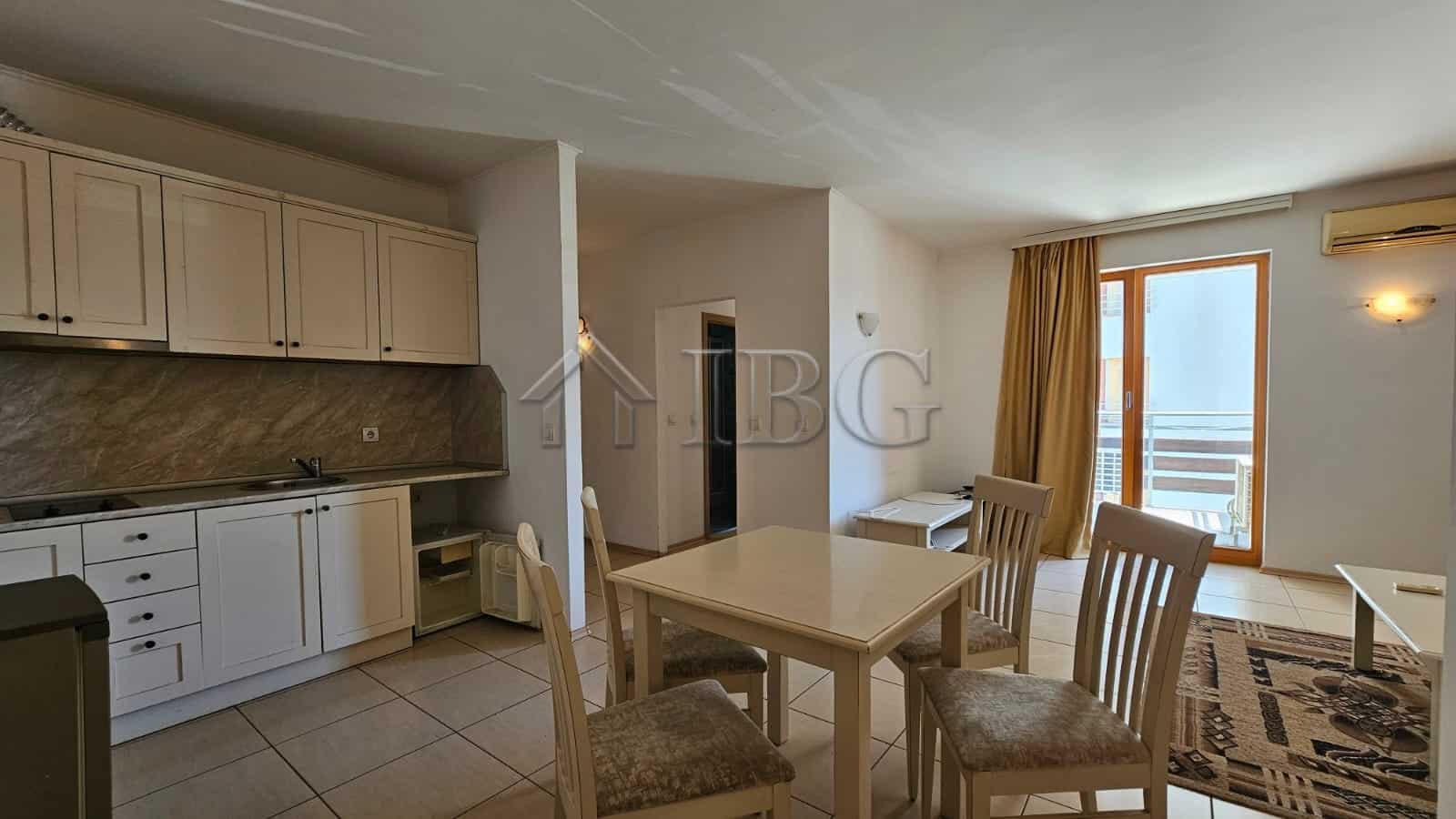 Bright living room with dining area and balcony in Tria Apartments, Sunny Beach.