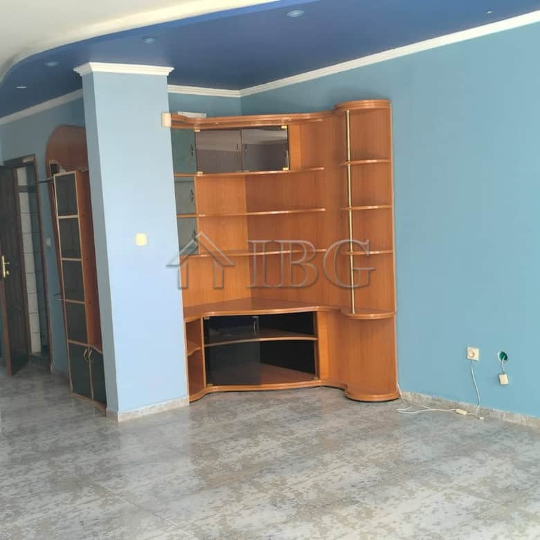 Bright living room with panoramic sea views in Sveti Vlas. Modern interior with wooden shelving and.