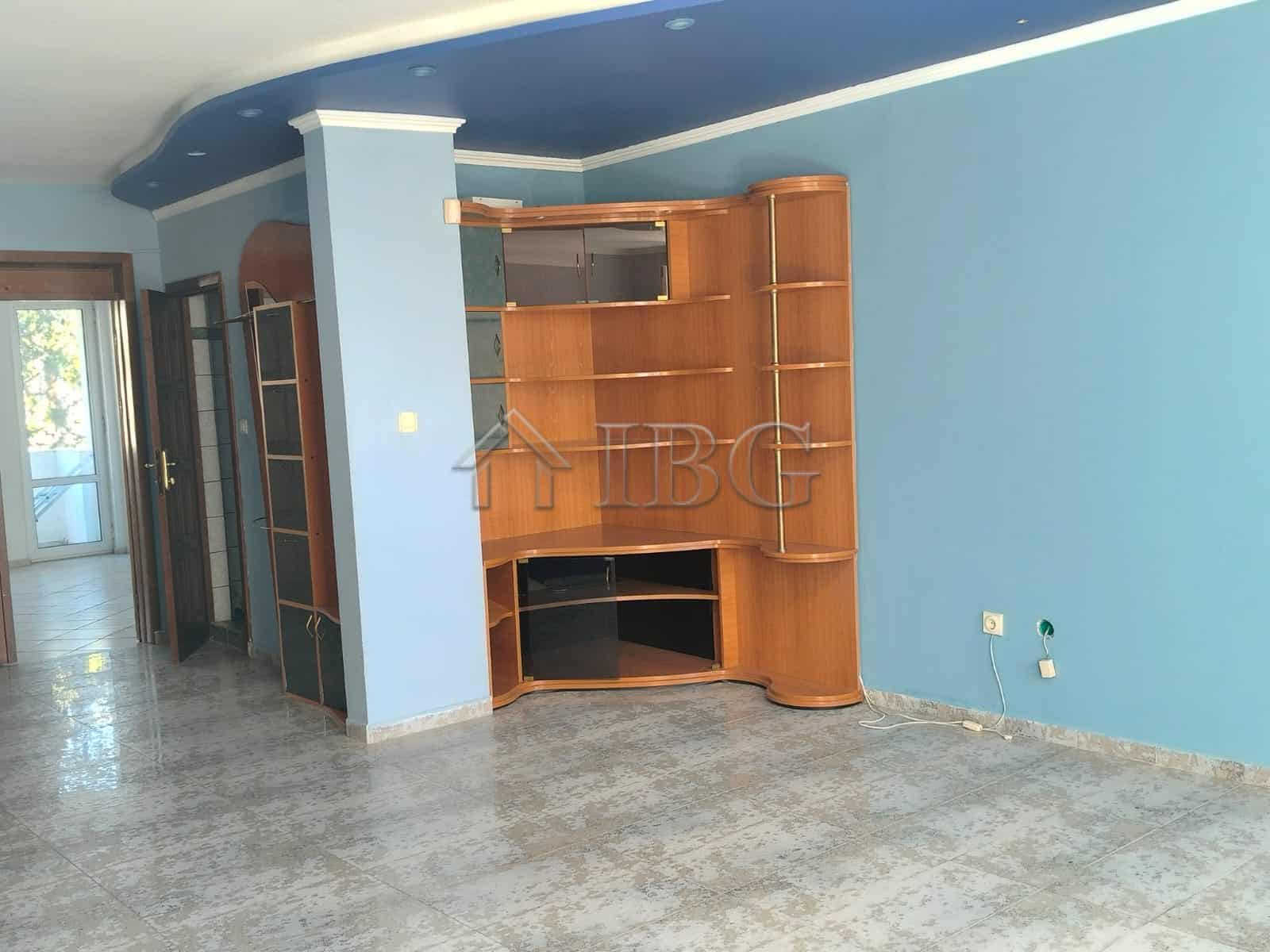 Bright living room with panoramic sea views in Sveti Vlas. Modern interior with wooden shelving and.