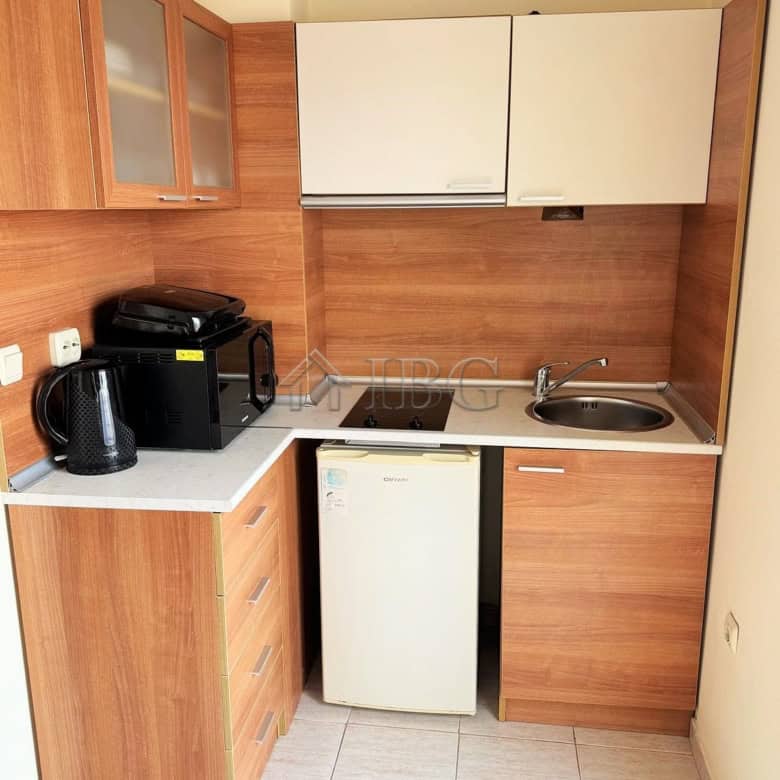 Apartment with compact kitchen and pool view in Pollo Resort, Sunny Beach.
