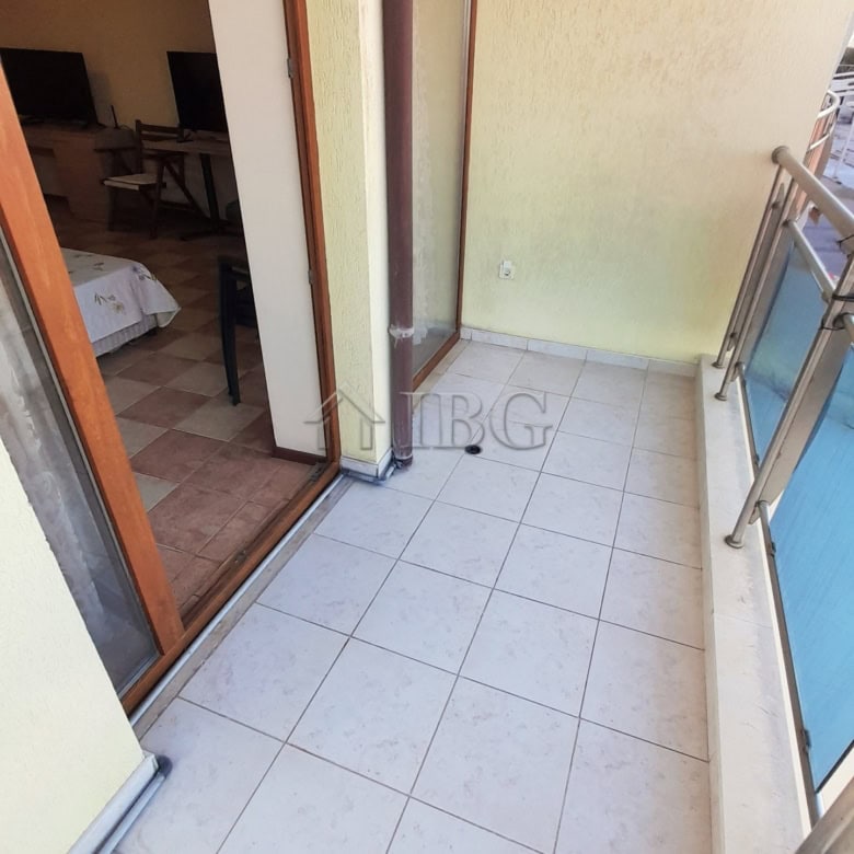 Small studio balcony with glass railing in Kaya, Sunny Beach, offering outdoor space and views.
