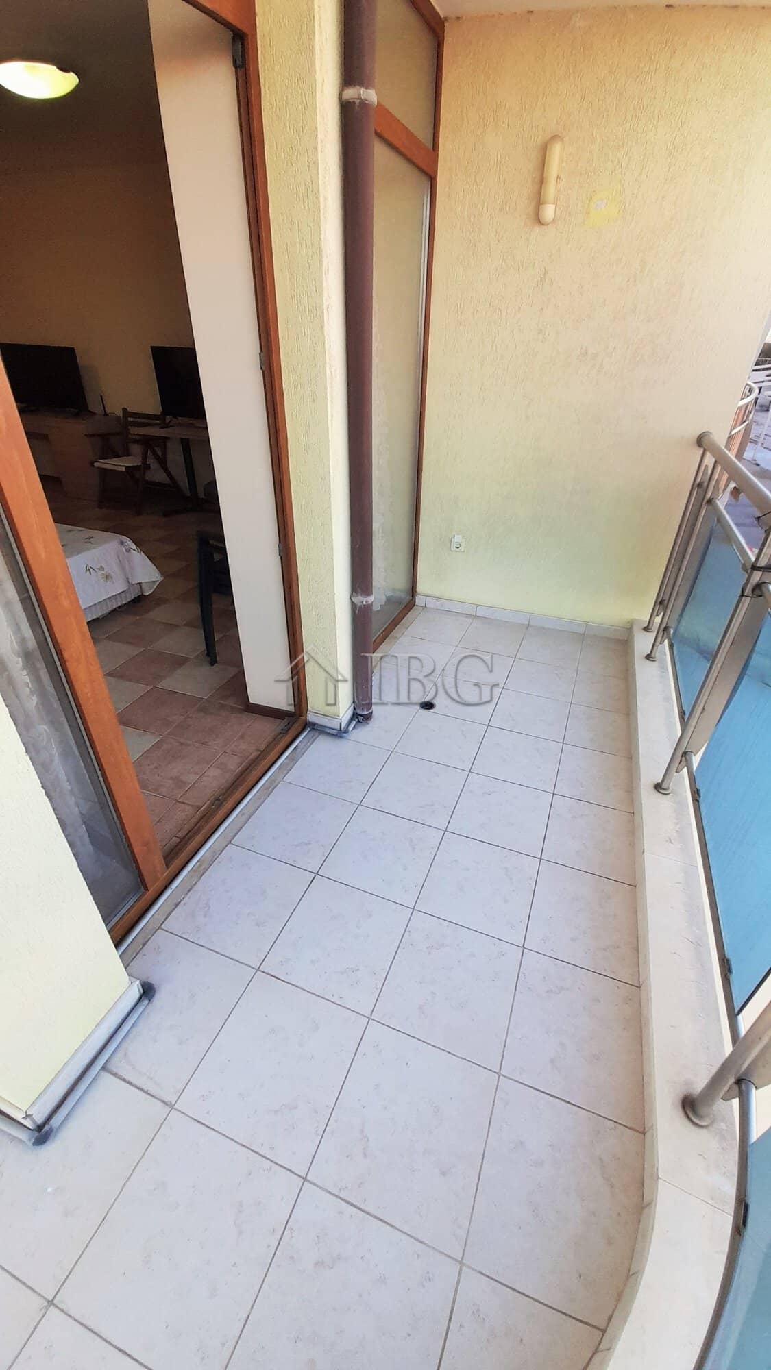 Cozy Studio with Balcony in Sunny Beach Small studio balcony with glass railing in Kaya, Sunny Beach, offering outdoor space and views.