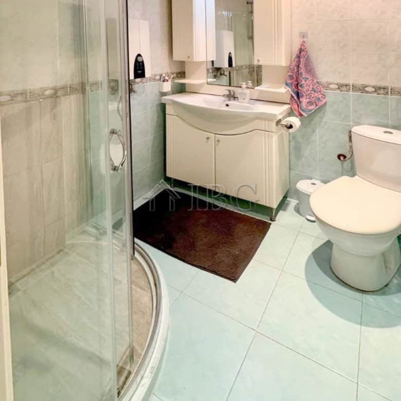 Modern furnished studio bathroom with shower, sink, and toilet in Sun City 1, Sunny Beach.