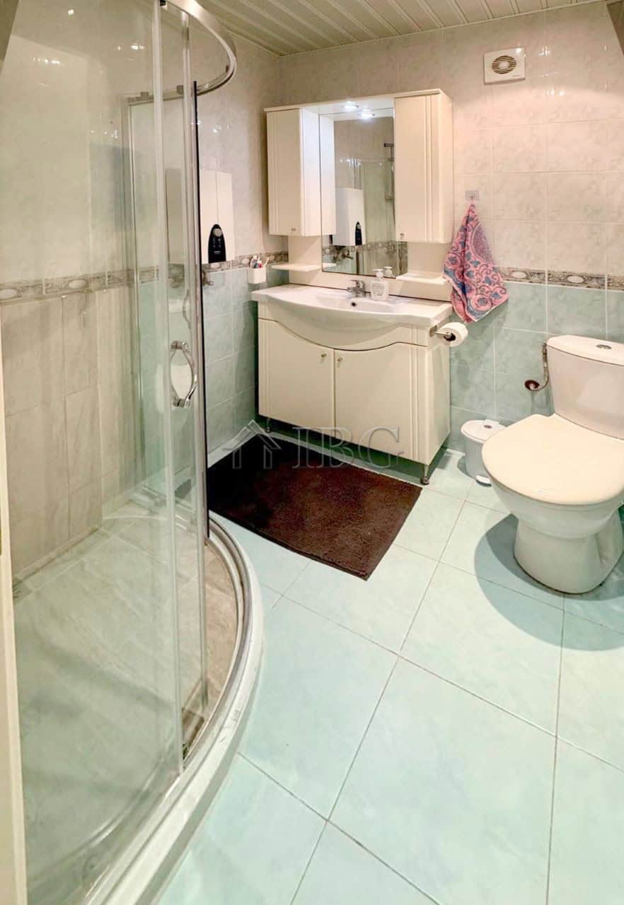Modern furnished studio bathroom with shower, sink, and toilet in Sun City 1, Sunny Beach.