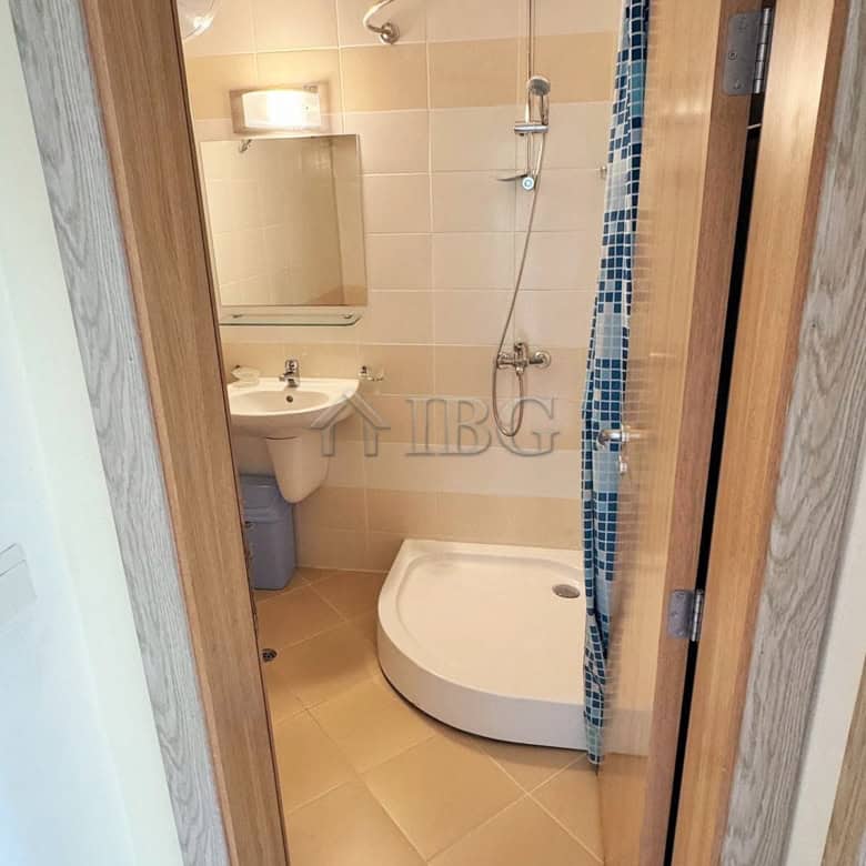 Compact bathroom featuring a modern shower and sink at Pollo Resort, Sunny Beach.