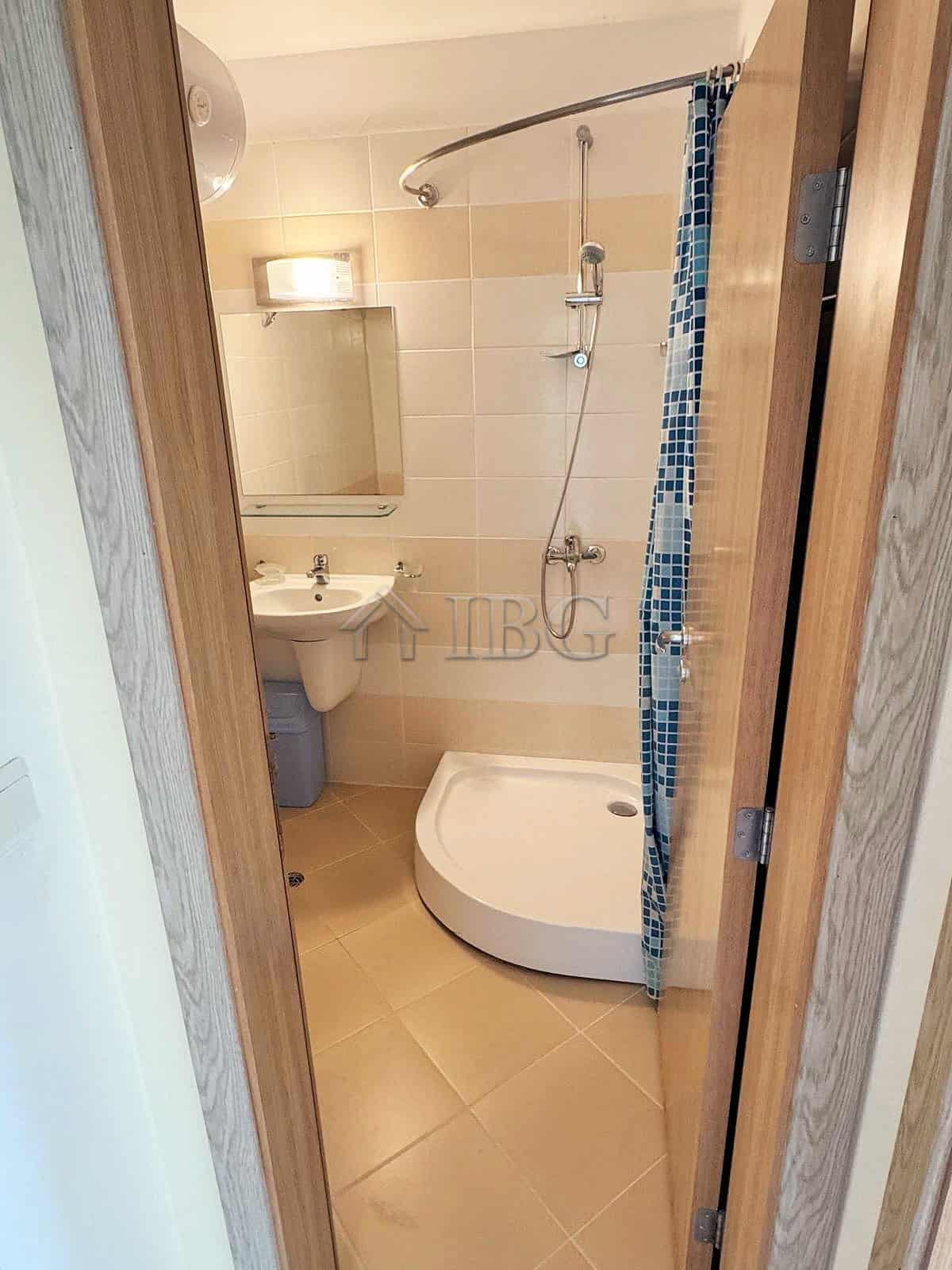 Cozy Bathroom with Shower at Pollo Resort Compact bathroom featuring a modern shower and sink at Pollo Resort, Sunny Beach.