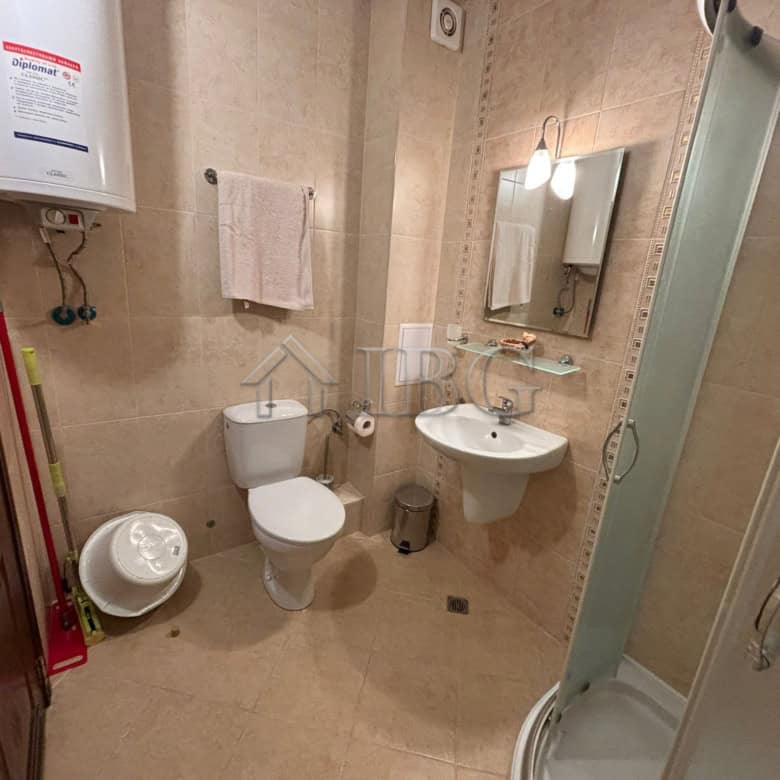 Furnished studio bathroom with shower, toilet, and sink in Diamant Residence, Sunny Beach.