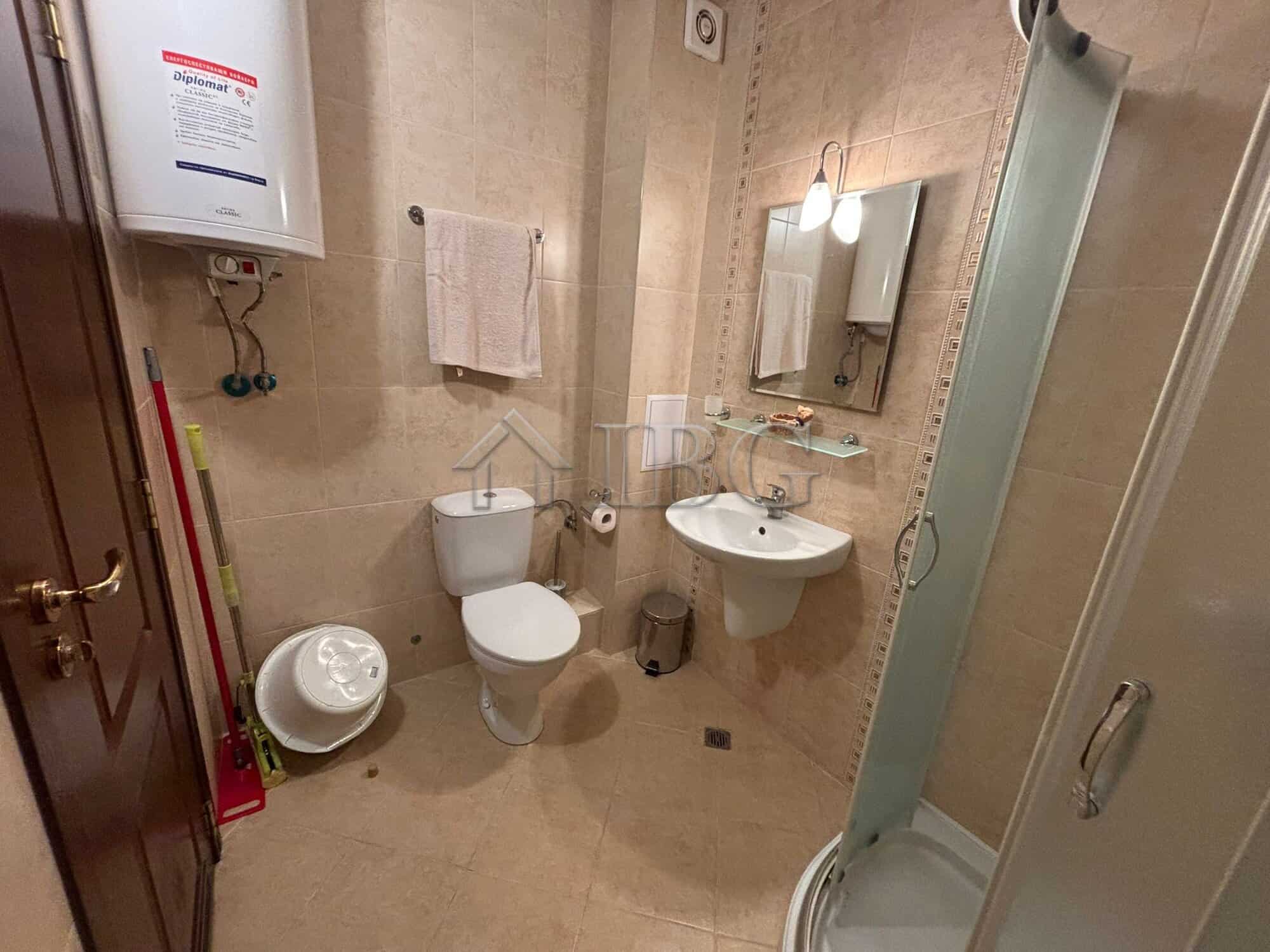 Furnished studio bathroom with shower, toilet, and sink in Diamant Residence, Sunny Beach.