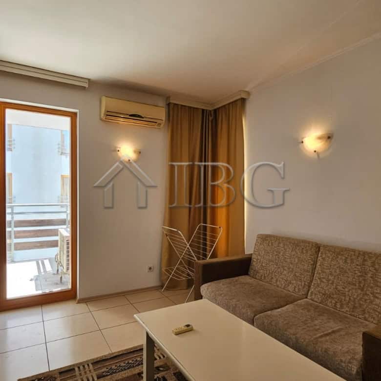 Bright living room with balcony access in Tria Apartments, Sunny Beach.