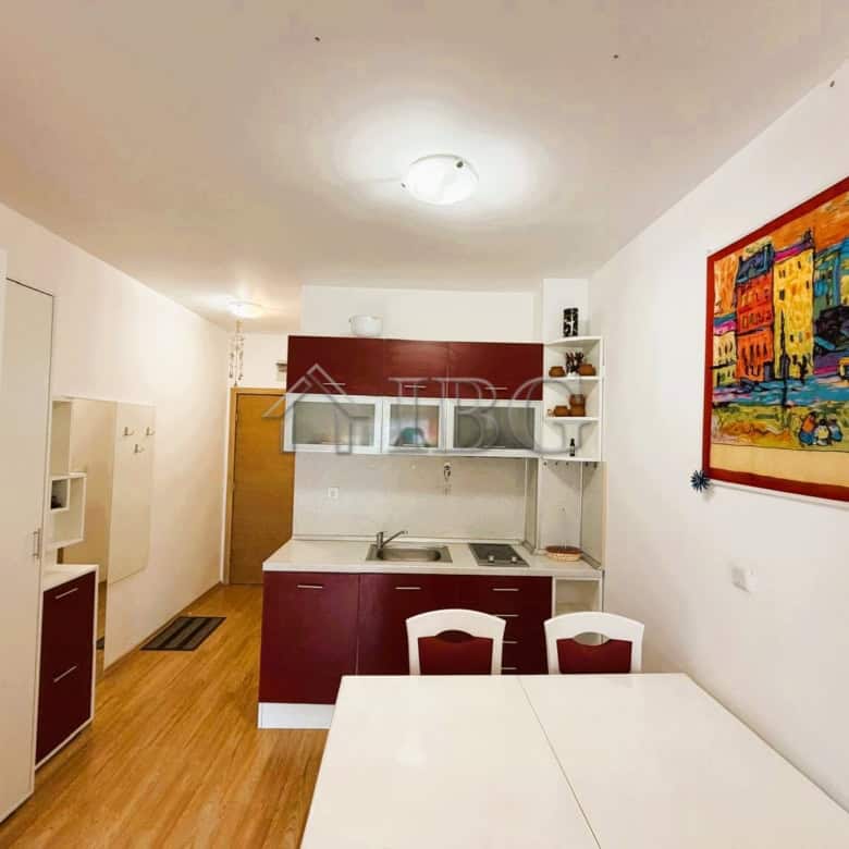 Modern 2-bedroom apartment with park and tennis court views, bright interior, and contemporary furni.