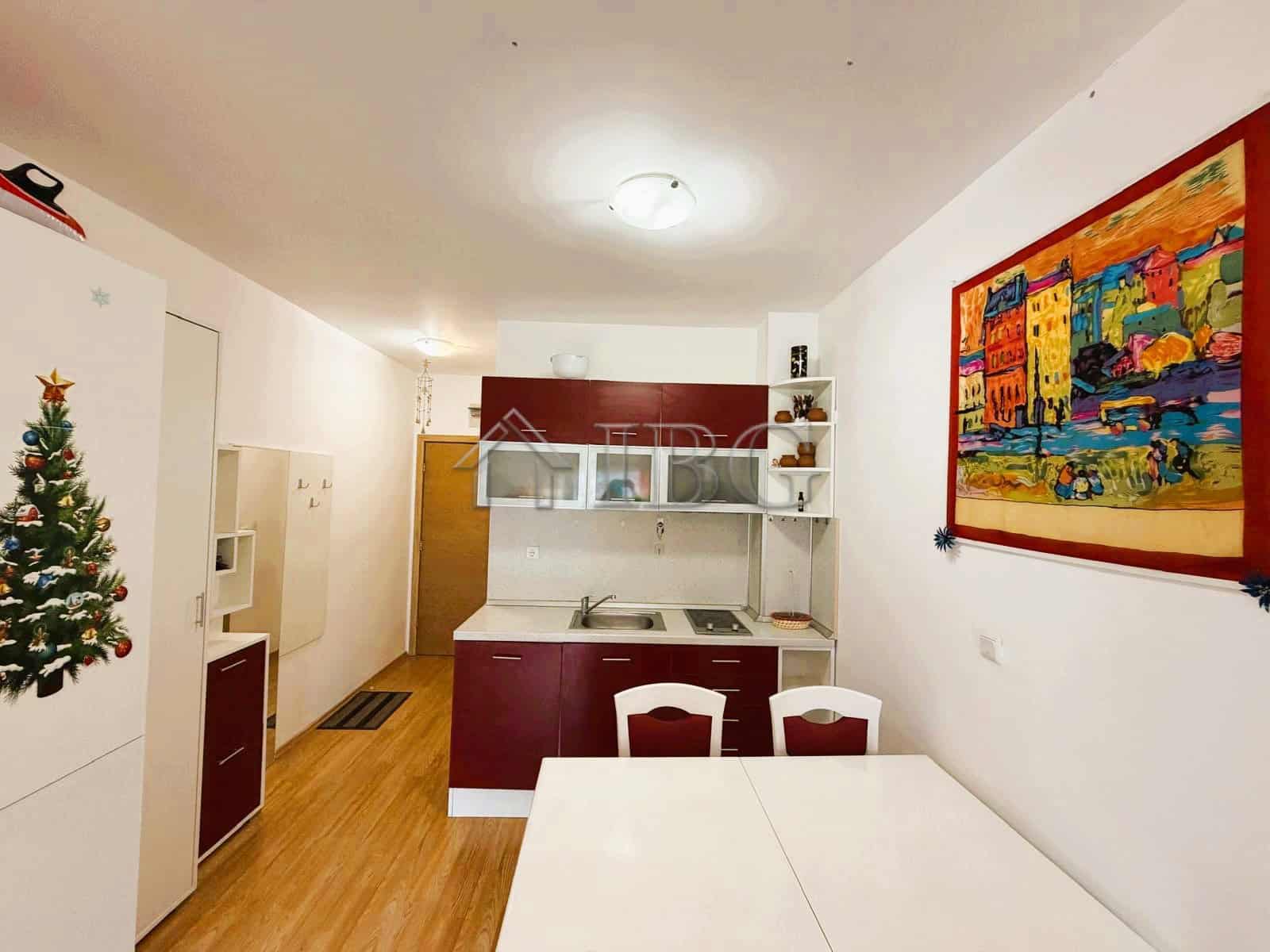 Modern 2-bedroom apartment with park and tennis court views, bright interior, and contemporary furni.