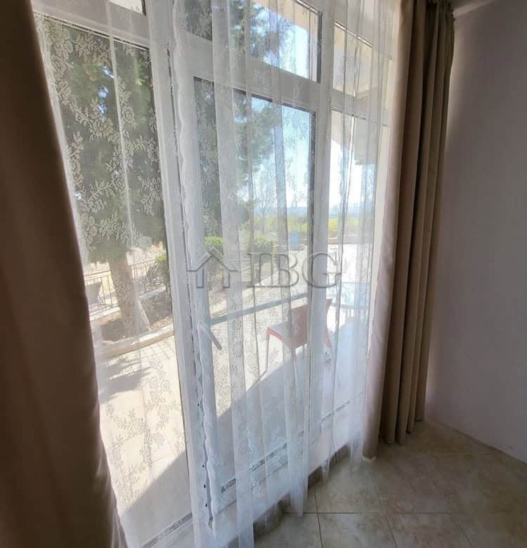 One-bedroom apartment with garden access and large windows for natural light.