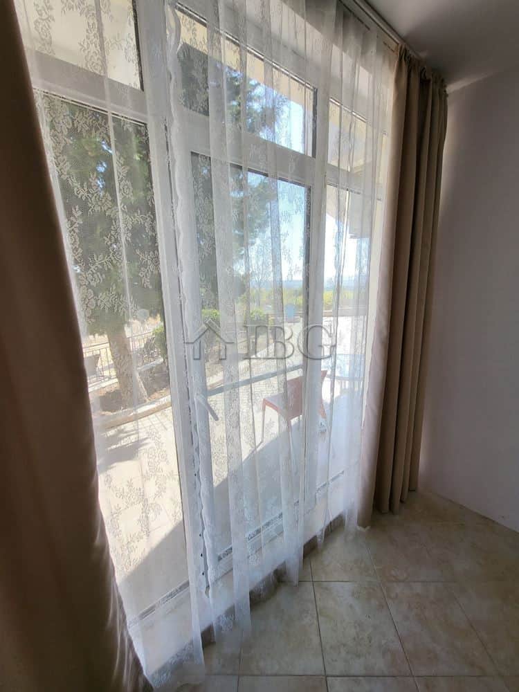 One-bedroom apartment with garden access and large windows for natural light.